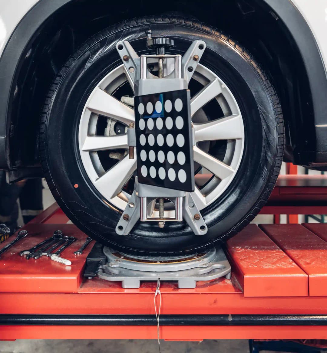 Vehicle undergoing static ADAS calibration with OEM targets in Melbourne workshop for insurance repair validation