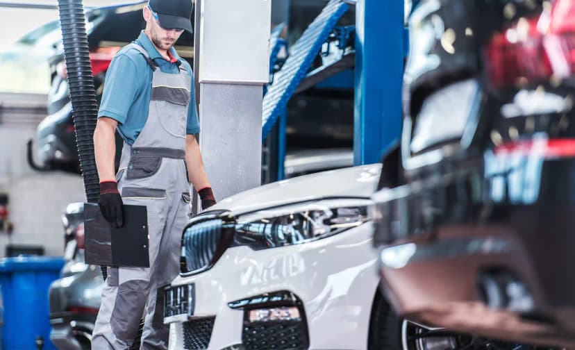 ADAS technician performing camera calibration on vehicle dashboard in Melbourne workshop