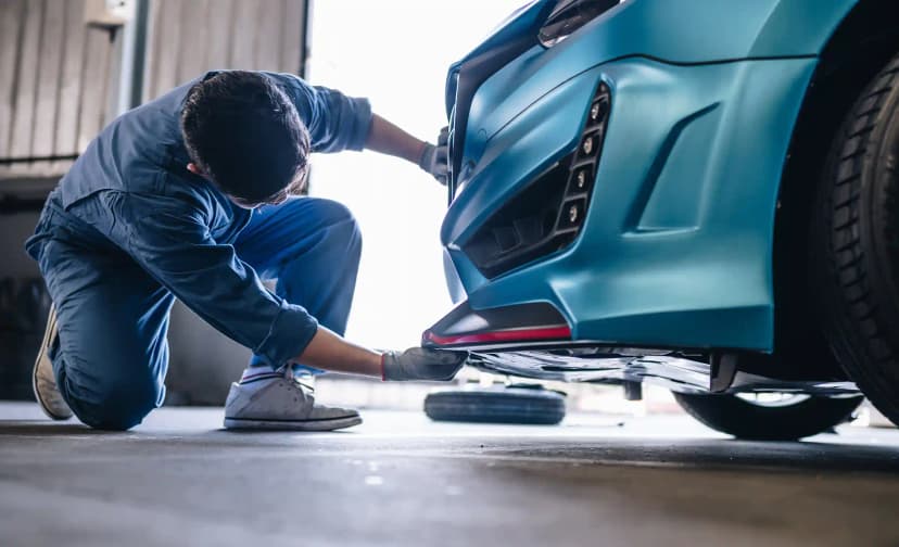 Technician using OEM diagnostic scanner for ADAS radar and sensor calibration in Melbourne