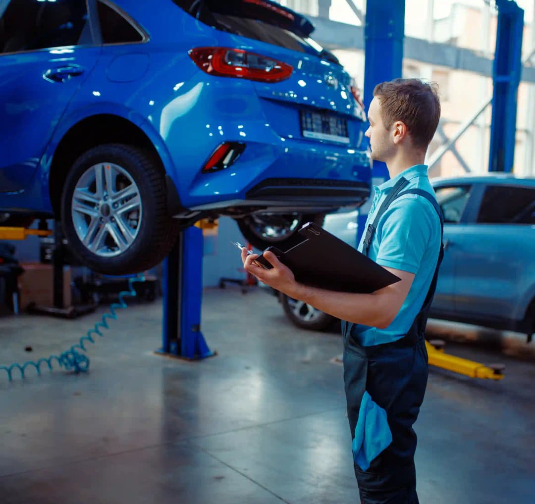 ADAS technician using diagnostic tools on vehicle in Airport West workshop for precise calibration