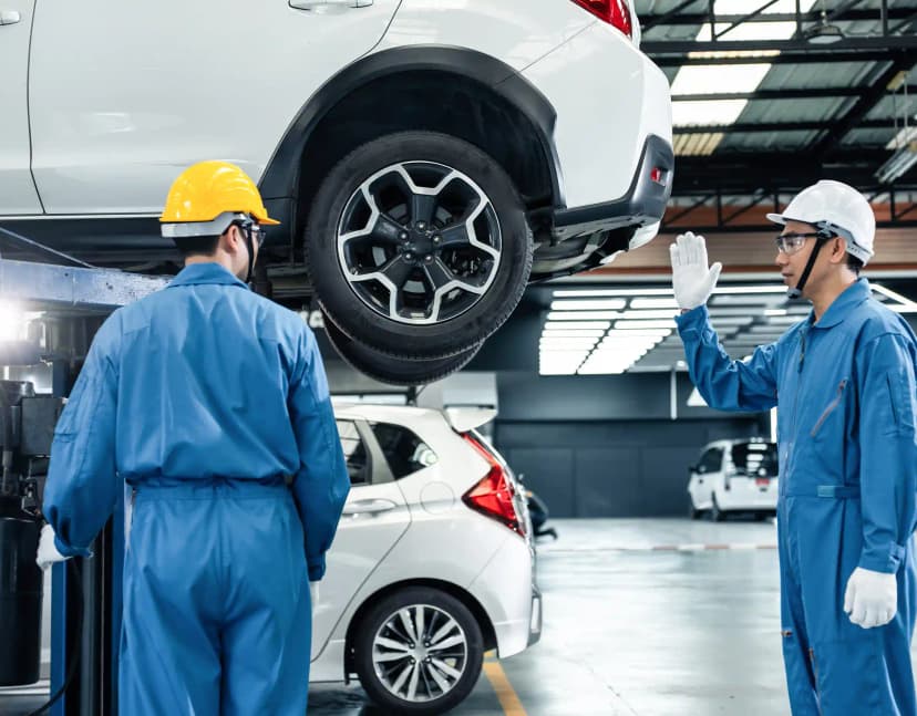 Technician performing ADAS camera calibration on vehicle windscreen in Campbellfield Melbourne workshop