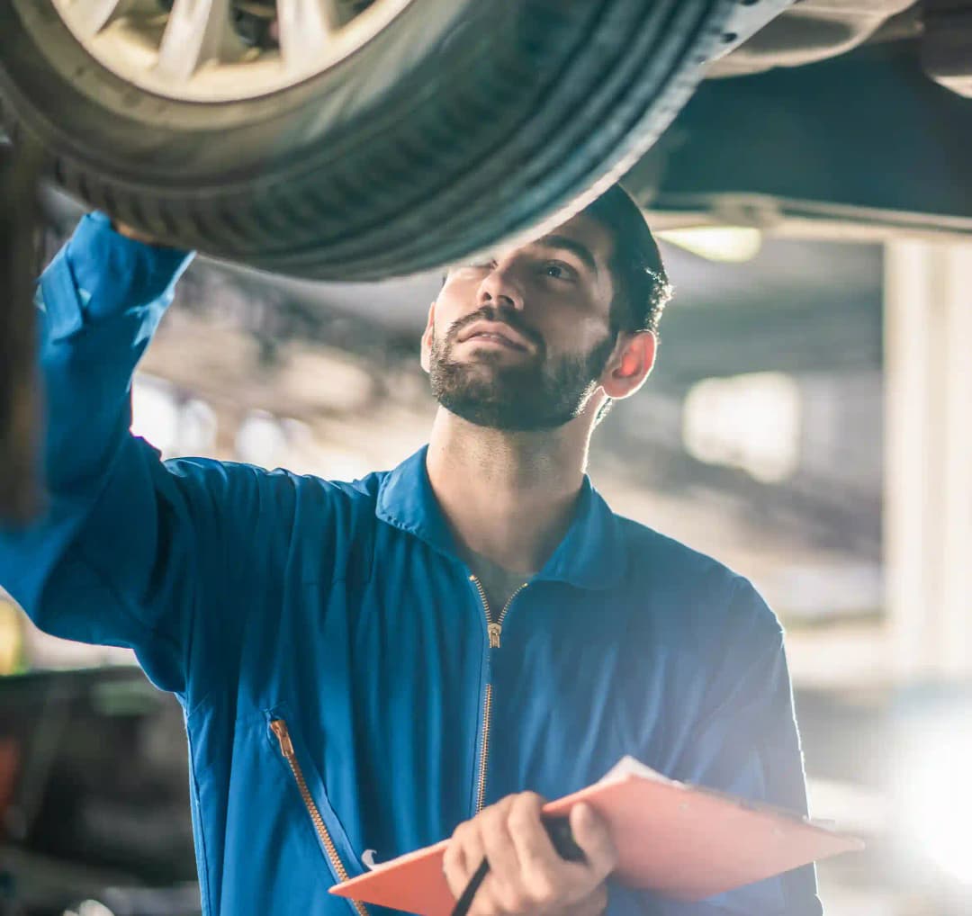 ADAS technician using diagnostic tools on vehicle in Campbellfield workshop for precise calibration