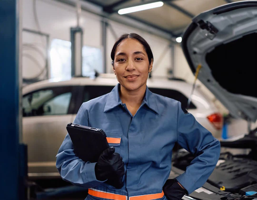 ADAS technician using diagnostic tools on vehicle in Greenvale workshop for precise calibration