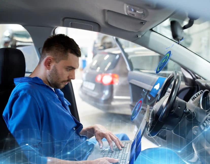 Technician performing ADAS camera calibration on vehicle windscreen in Tullamarine Melbourne workshop