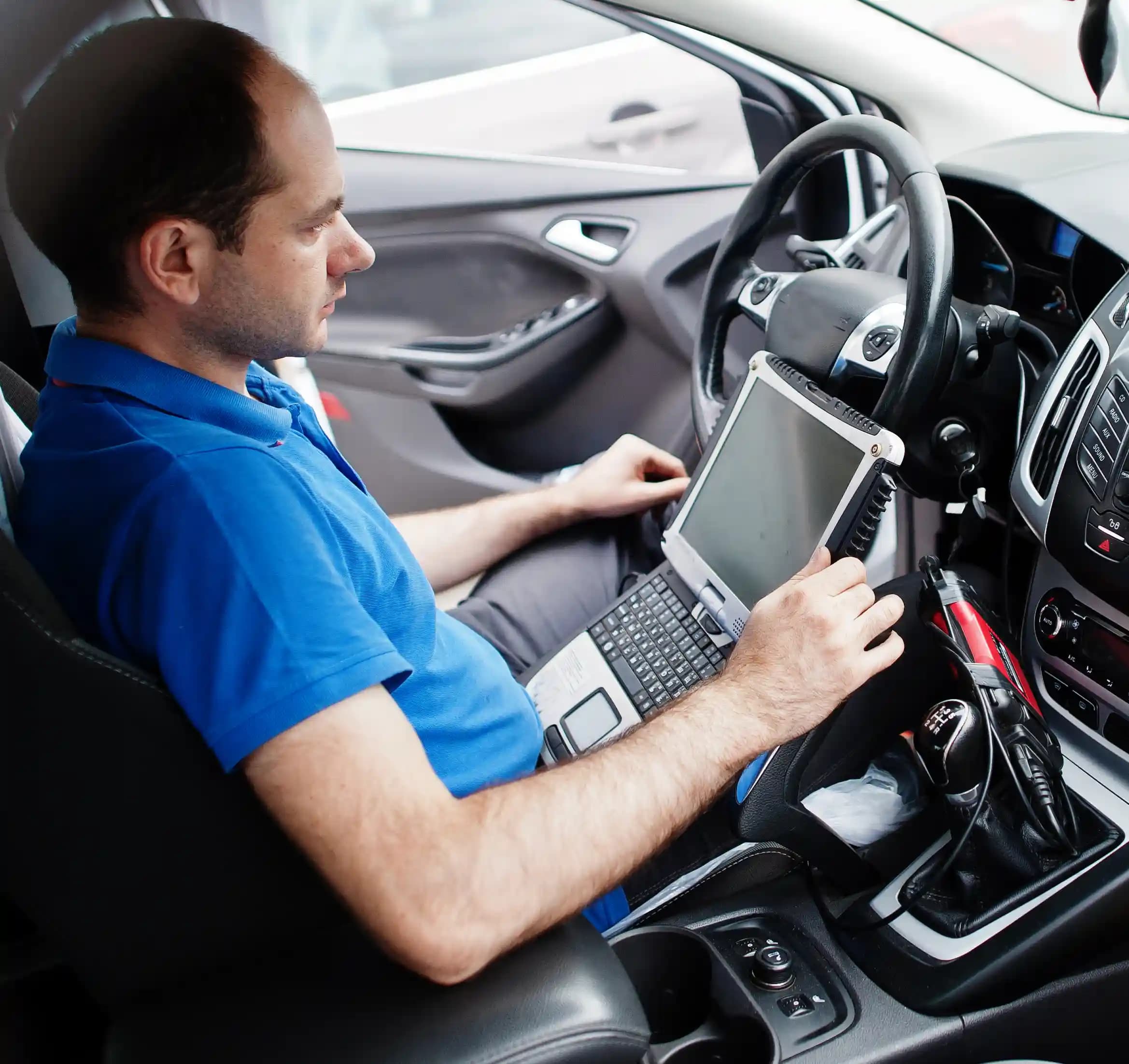 Technician performing ADAS camera calibration on vehicle windscreen in Pascoe Vale Melbourne workshop