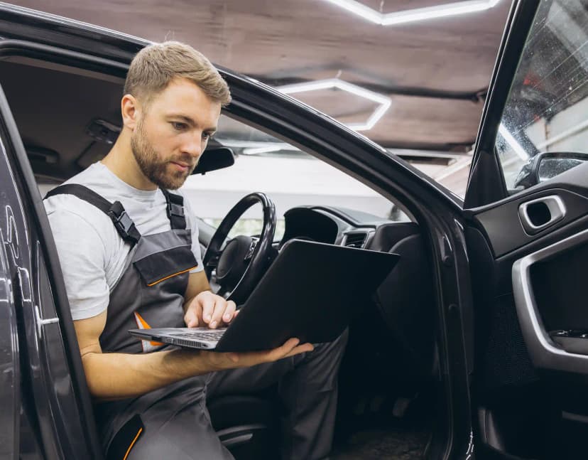 Technician performing ADAS camera calibration on vehicle windscreen in Sunshine Melbourne workshop
