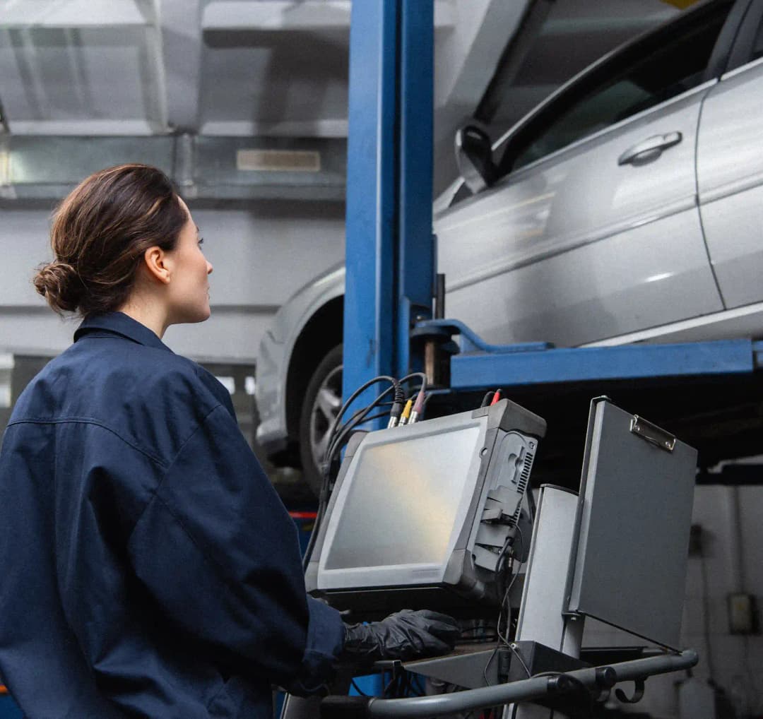 ADAS technician using diagnostic tools on vehicle in Tullamarine workshop for precise calibration