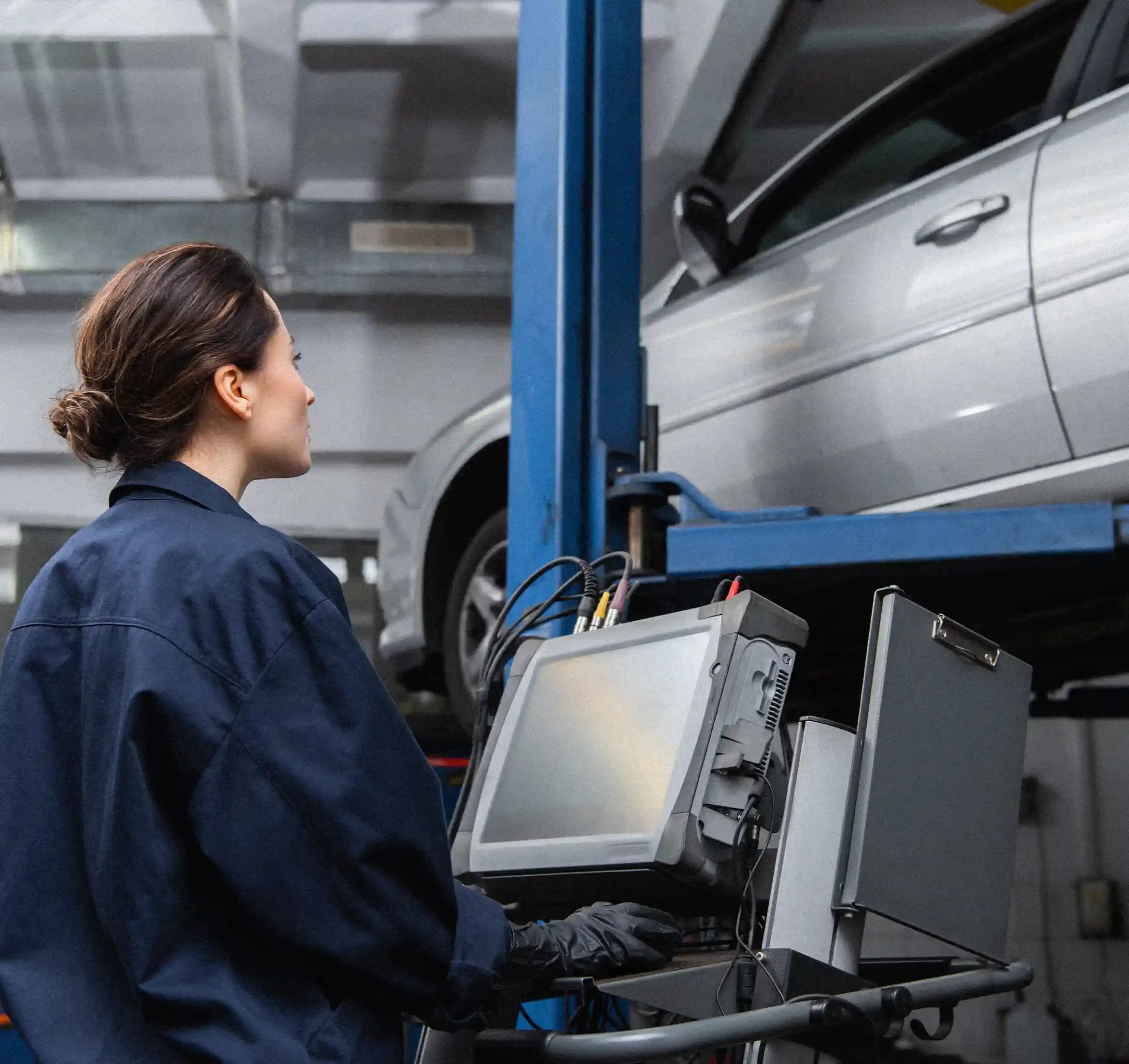 ADAS technician using diagnostic tools on vehicle in Tullamarine workshop for precise calibration