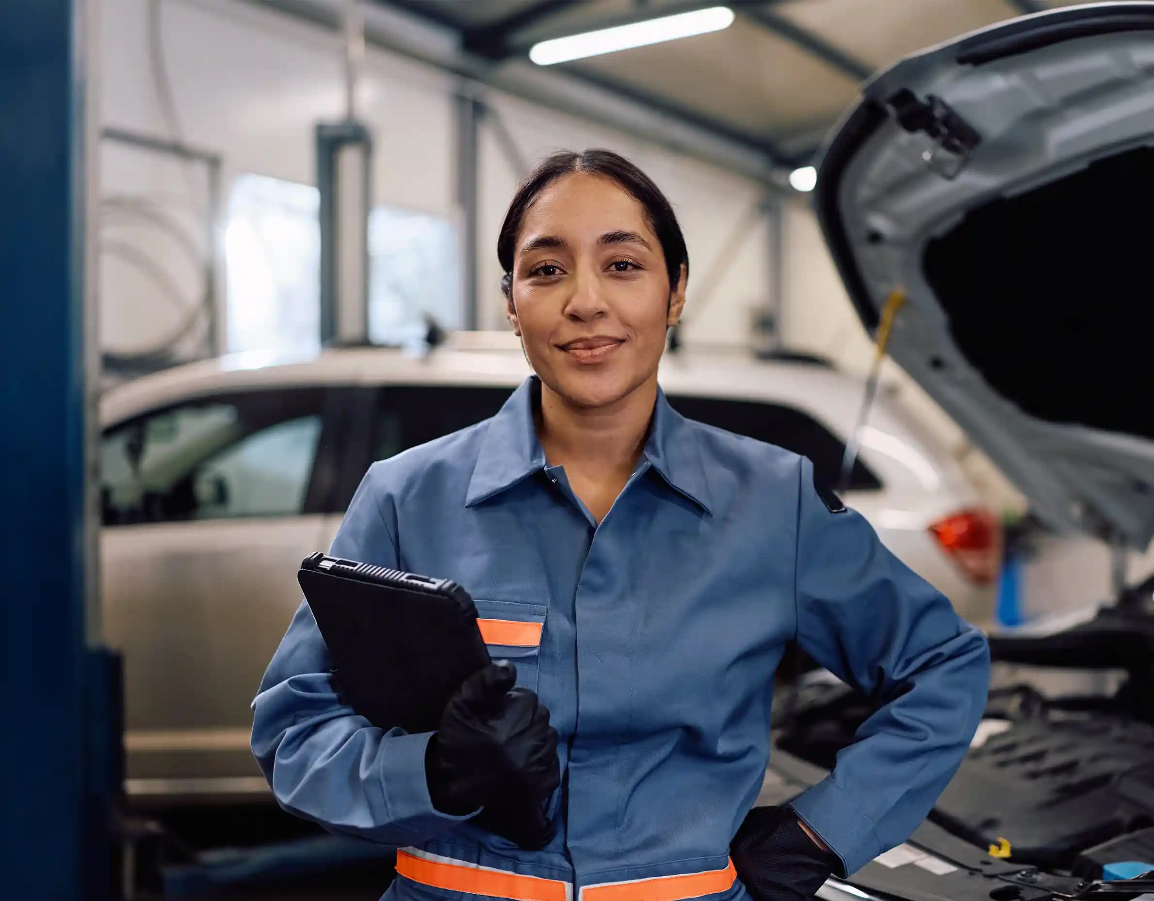 ADAS technician using diagnostic tools on vehicle in Greenvale workshop for precise calibration